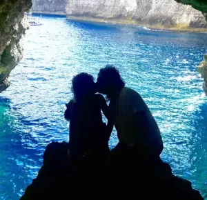 hidden sea caves around Comino Malta, featuring dark chambers and dramatic limestone accessed by private boat.