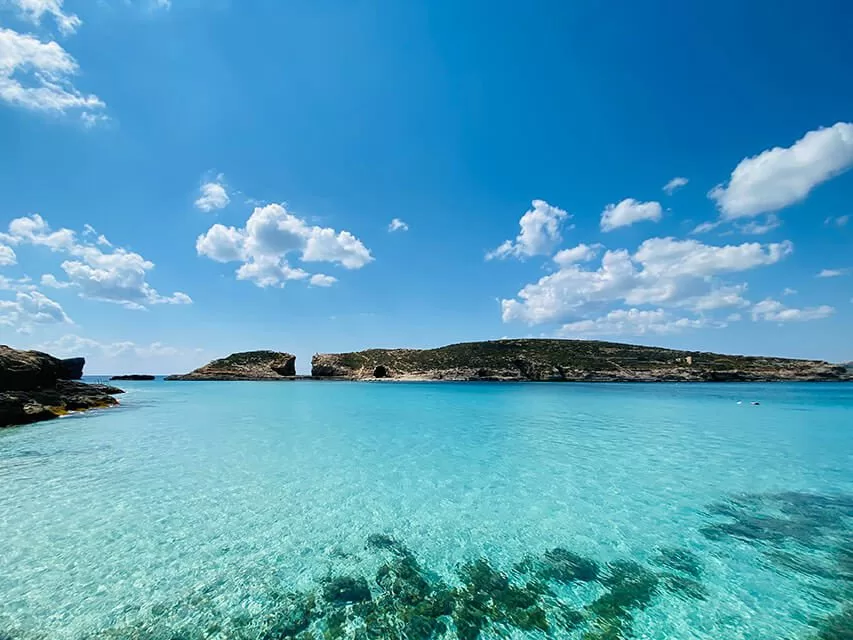 Blue Lagoon blue waters at Comino with crystal clear turquoise sea, perfect for swimming and enjoying a private boat experience in Malta.