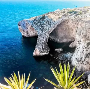 Blue Grotto Malta showing dramatic cliffs and deep blue sea, one of the island’s most famous coastal landmarks.