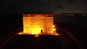 comino tower at night