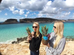 two ladies drinking pineapple cocktails at blue lagoon in the winter