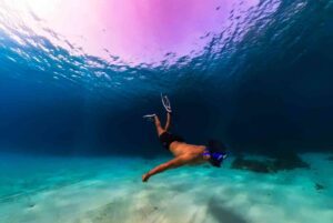 Snorkeling tour at the Blue Lagoon in Comino Malta with crystal-clear turquoise water captured using an Insta360 camera.