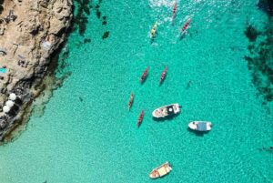 Boat anchored in Blue Lagoon Malta during private boat charter with turquoise water