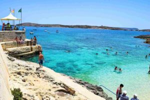 Hondoq Bay Gozo Malta blue water beach cliff diving spot perfect for private boat tour swimming snorkeling clear water experience