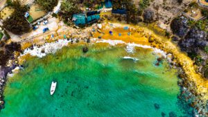 San Blas Bay Gozo Malta secluded red sand bay visited on full day private boat trip